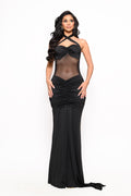 Woman wearing the Aura Black Mesh Maxi Dress featuring a sheer mesh bodice, halter neckline, and ruched skirt.